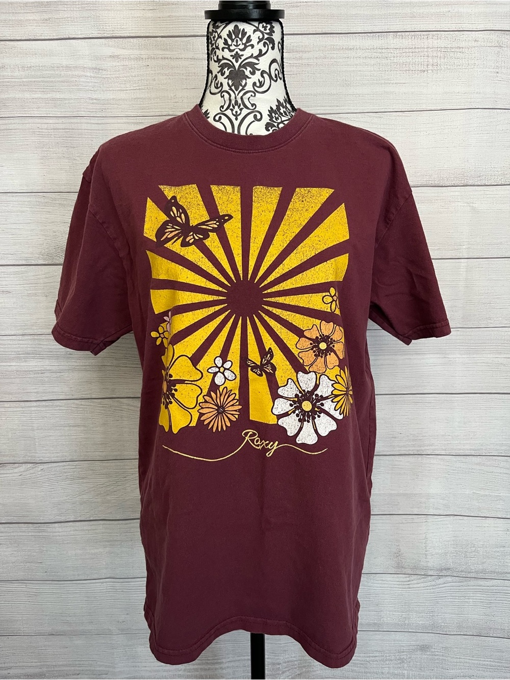 Roxy | Maroon Short-Sleeve Tee with Yellow Floral Sunburst Graphic